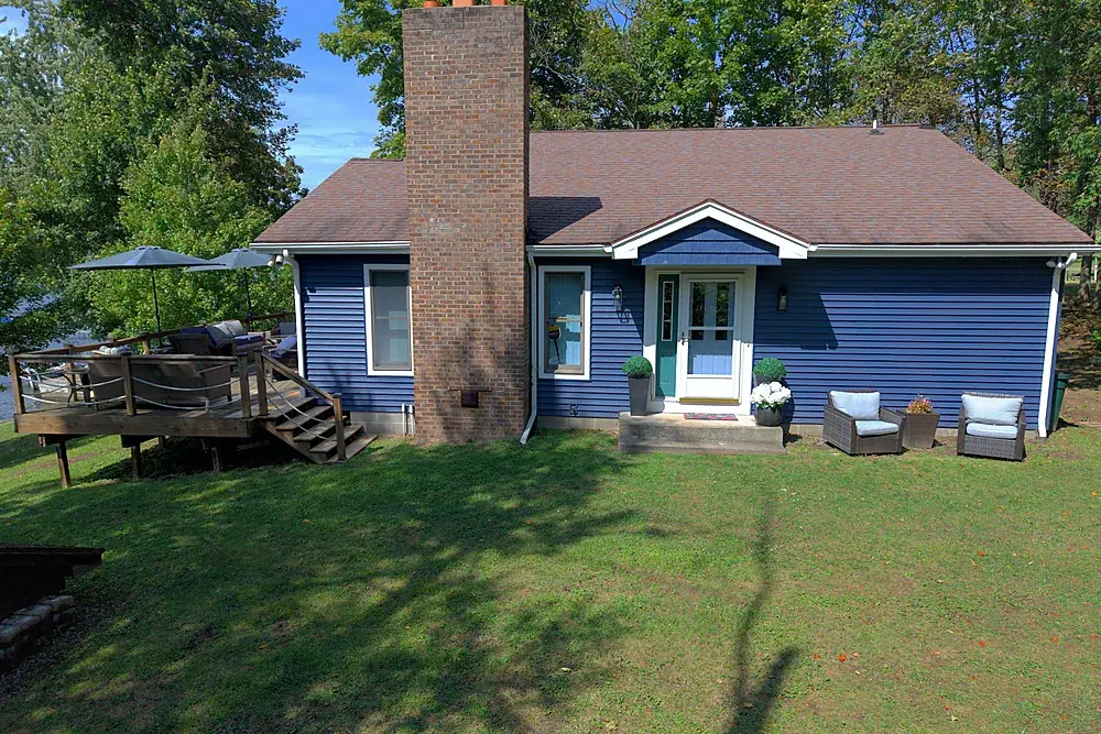 Drone photo of the front elevation of a lakefront home in Rochester, New York