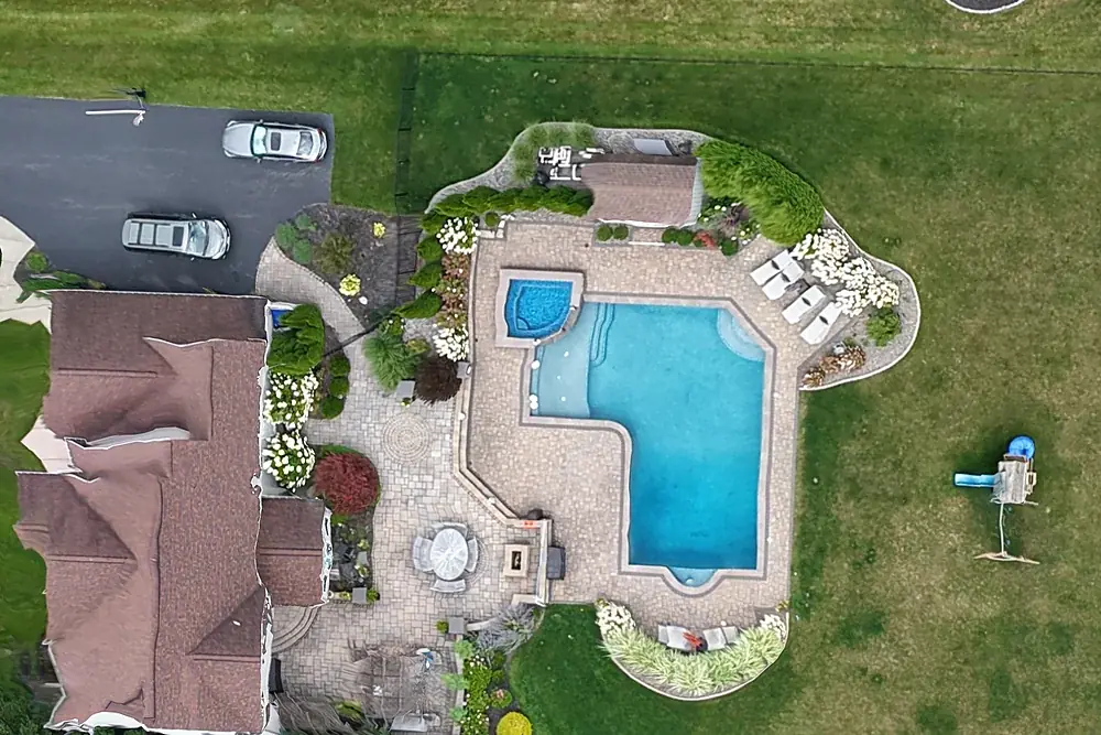 Full-resolution detail from a drone orthomosaic showing a house, pool and paver patio at 1.9 centimetres per pixel