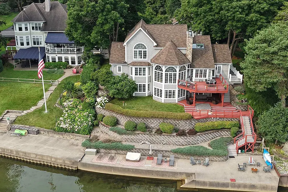 Unbranded aerial photograph of a waterfront estate, delivered white-label to a Rochester photographer