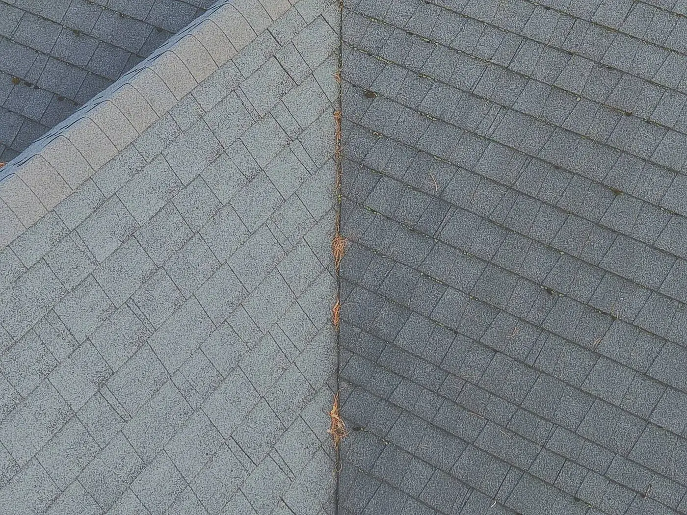 Drone photo showing water staining along a roof valley