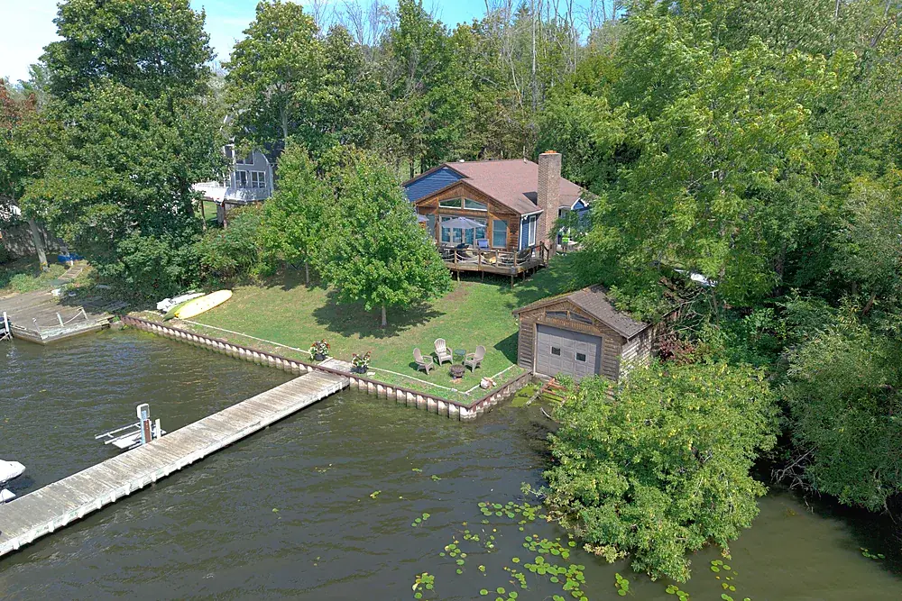Aerial view of a private dock on the water at a short-term rental near Rochester, New York